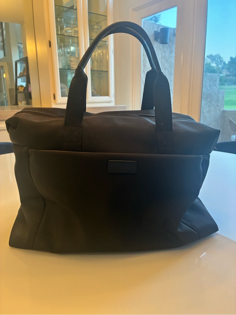 Mono Black Travel Duffel Bag with Top Handles and attachment for safe storage